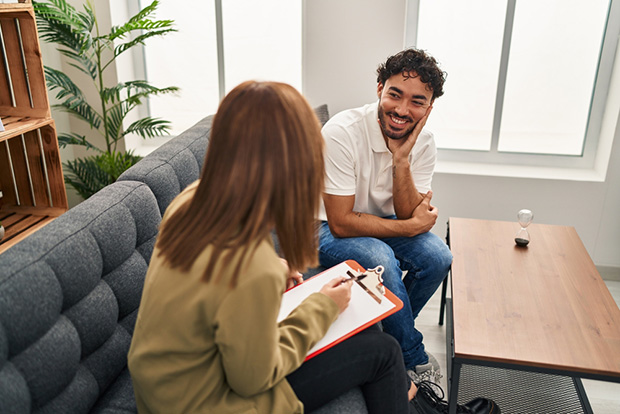 A man participates in therapy at an addiction treatment center.